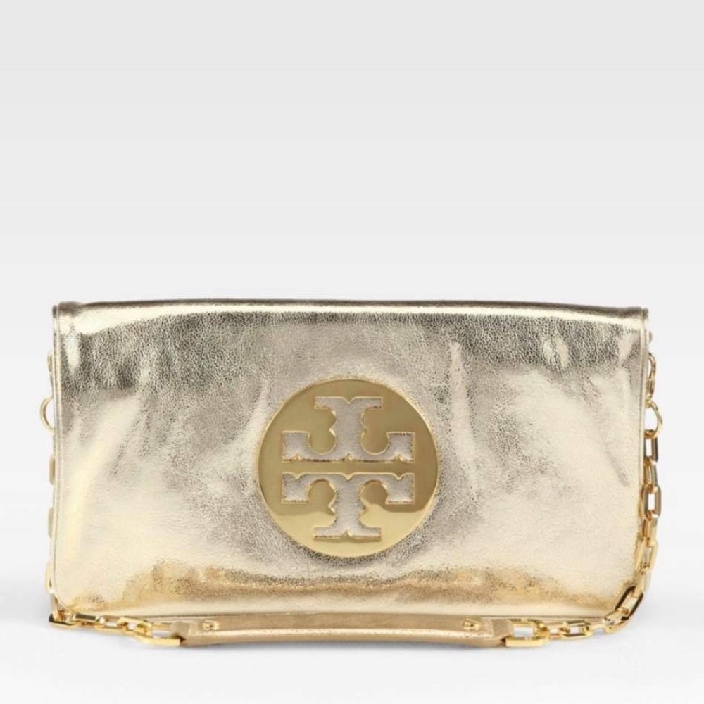 Gold Tory Burch clutch with shoulder strap